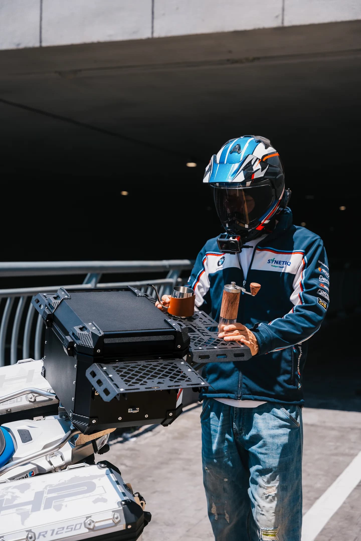 Rider beside an MT BOX tri-fold-wing motorcycle top case